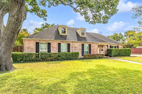 a front view of a house with swimming pool