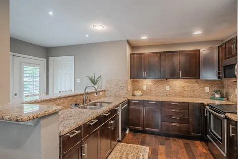 a kitchen with a sink and cabinets
