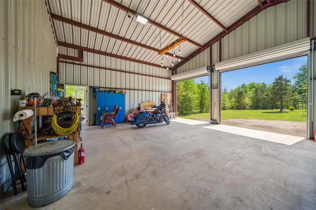 a view of a garden with a building in the background