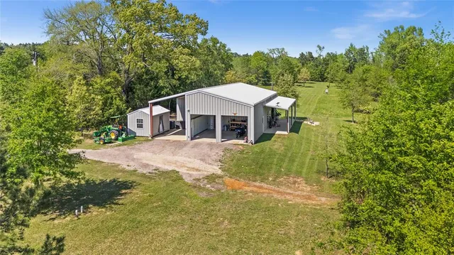 a backyard of a house with outdoor seating