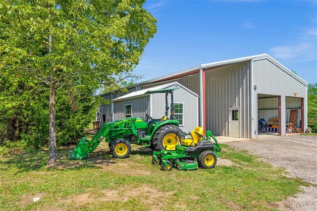 a view of yard with swimming pool and green space