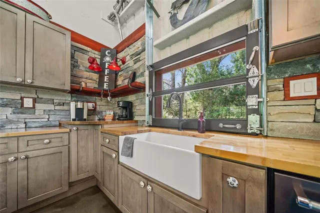 a kitchen that has a sink and a stove