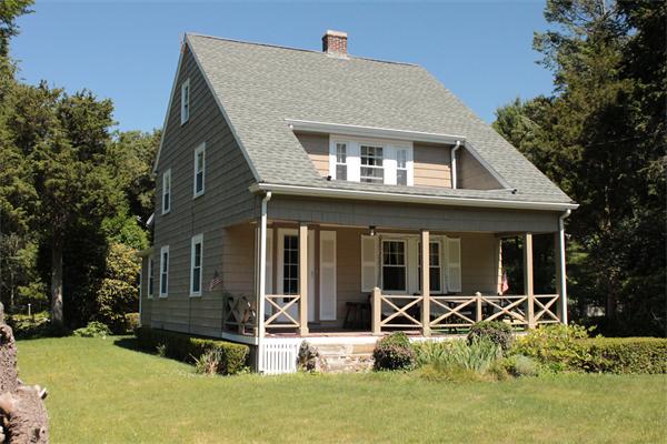 front view of a house with a yard