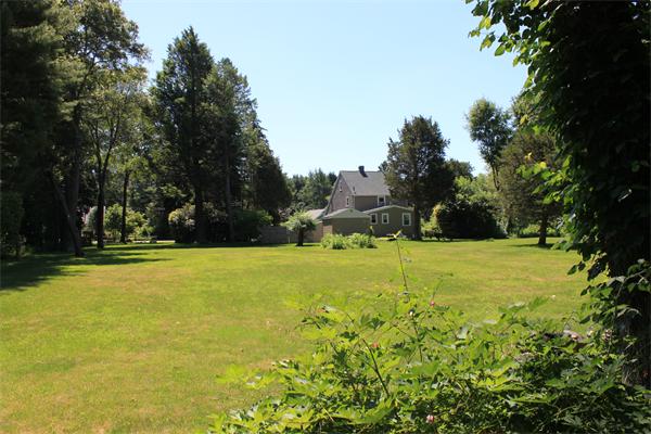 253 Lincoln Road Lincoln, MA 01773 - Photo 6 of 14 a view of swimming pool and trees in the background