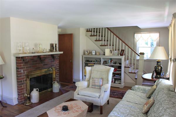 253 Lincoln Road Lincoln, MA 01773 - Photo 8 of 14 a living room with furniture and a fireplace