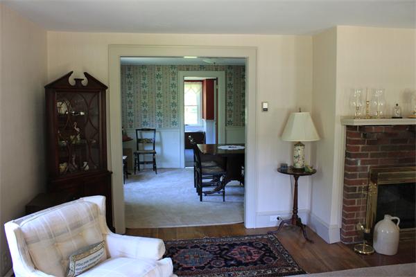 253 Lincoln Road Lincoln, MA 01773 - Photo 9 of 14 a living room with furniture and a fireplace