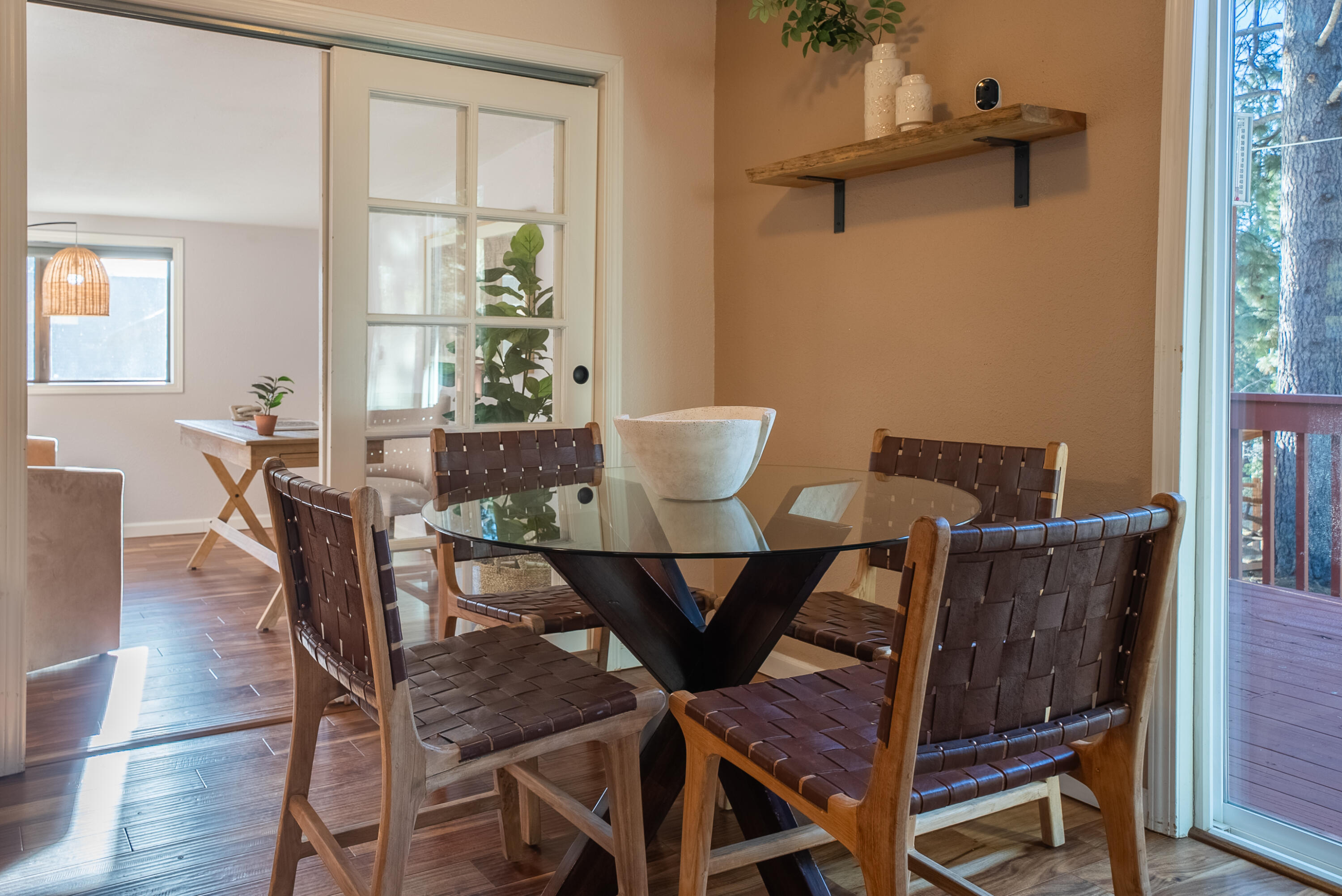 16879 Elsinore Road Bend, OR 97707 - Photo 7 of 48 a view of a dining room with furniture and wooden floor