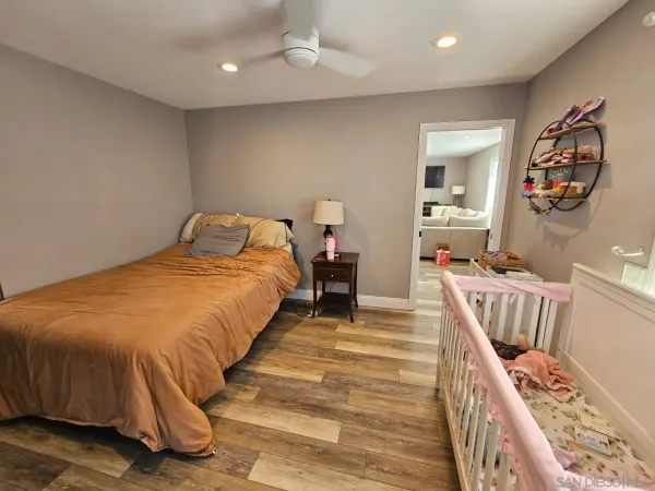 a view of an empty room with a kitchen