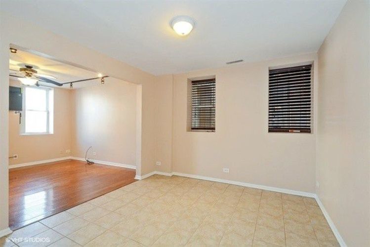 1631 West 18th Street, Unit 2 Chicago, IL 60608 - Photo 3 of 7 an empty room with windows and closet