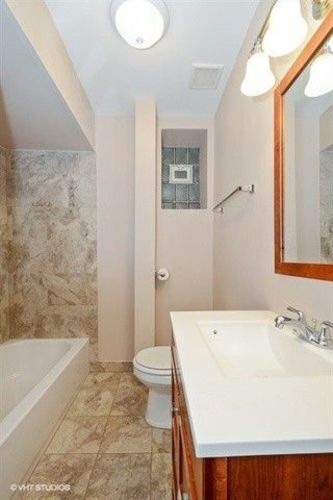 1631 West 18th Street, Unit 2 Chicago, IL 60608 - Photo 4 of 7 a bathroom with a sink a toilet and bathtub