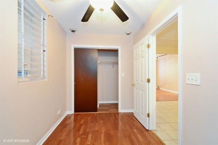1631 West 18th Street, Unit 2 Chicago, IL 60608 - Photo 6 of 7 a view of a hallway with wooden floor and closet
