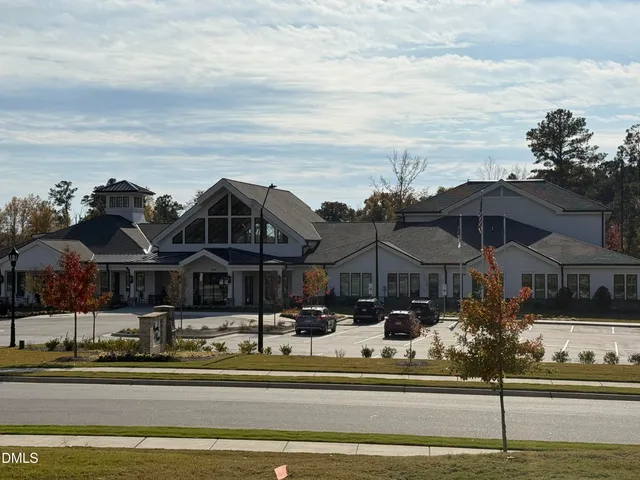 a view of a swimming pool with an outdoor seating
