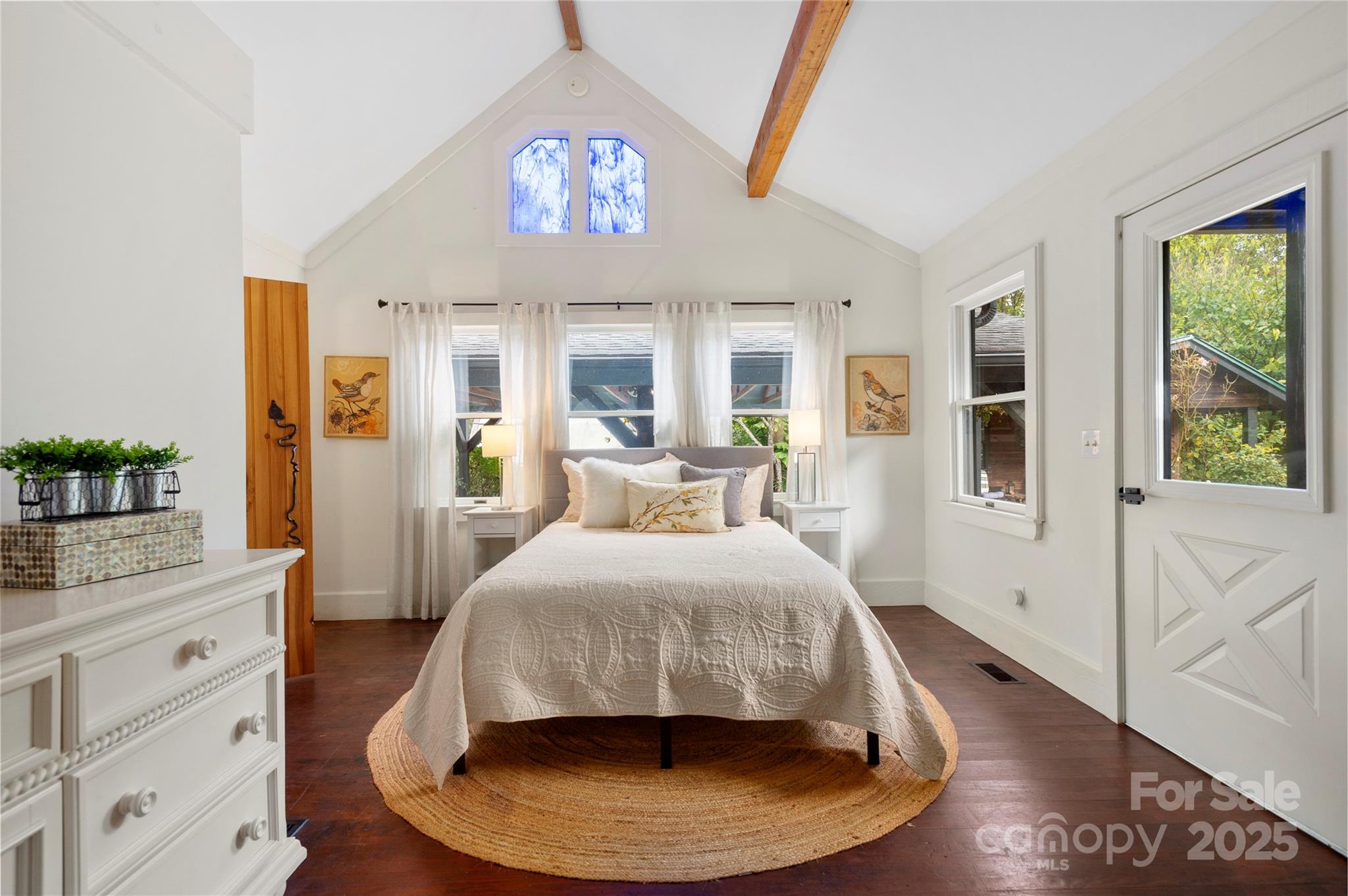 528 Padgettown Road Black Mountain, NC 28711 - Photo 18 of 43 a bed room with a bed and a chandelier