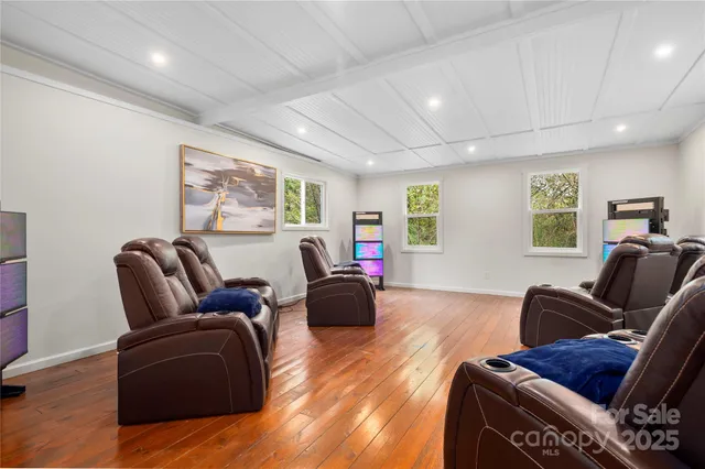 a living room with furniture window and wooden floor