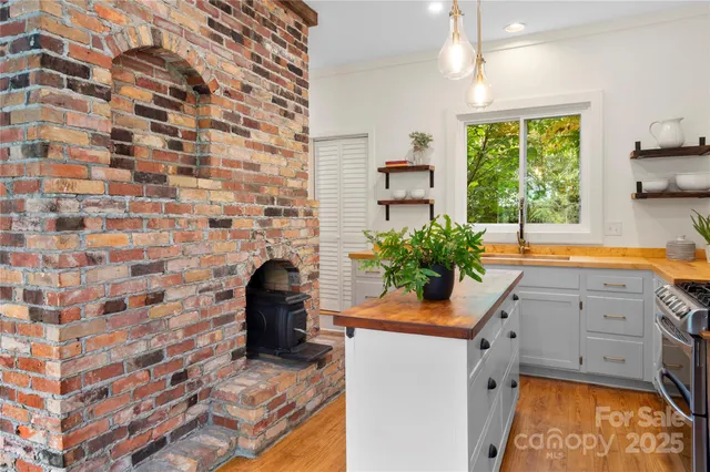 a kitchen with a sink and a window
