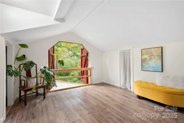 a view of livingroom with furniture wooden floor and window