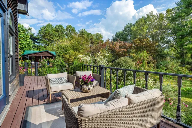 a view of balcony with furniture and outdoor seating