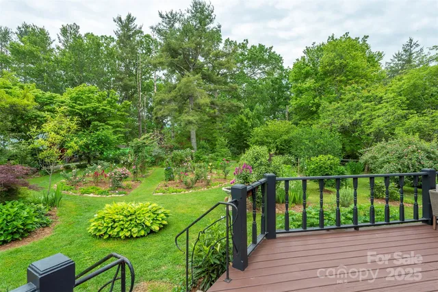 a front view of house with a garden