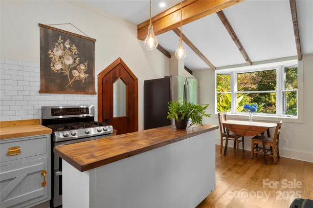 a view of kitchen with furniture and window