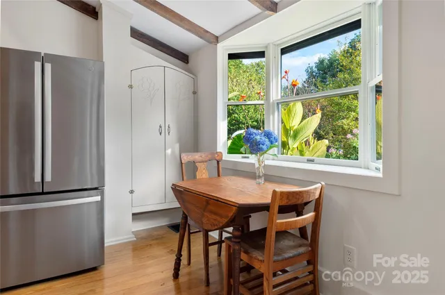 a dining room with furniture and window
