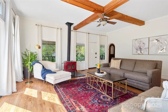 a living room with furniture rug and window