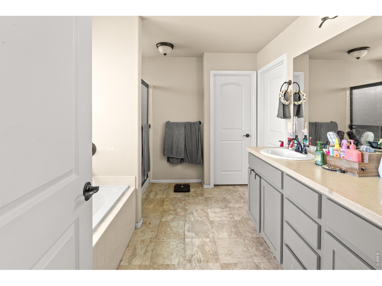 8847 16th St Road Greeley, CO 80634 - Photo 21 of 38 a bathroom with a sink and a mirror