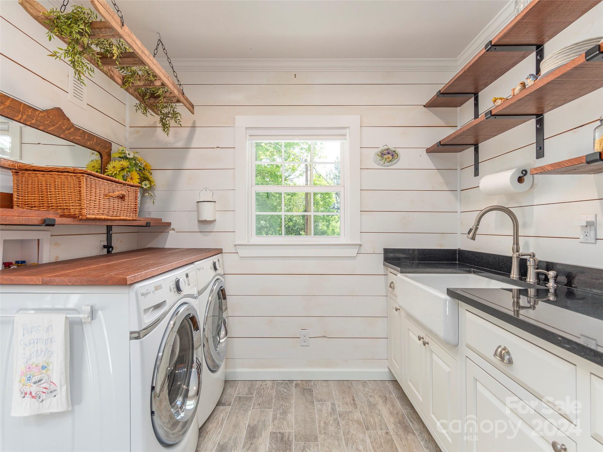 952 Thompson Cove Road Clyde, NC 28721 - Photo 14 of 43 a utility room with cabinets dryer and washer