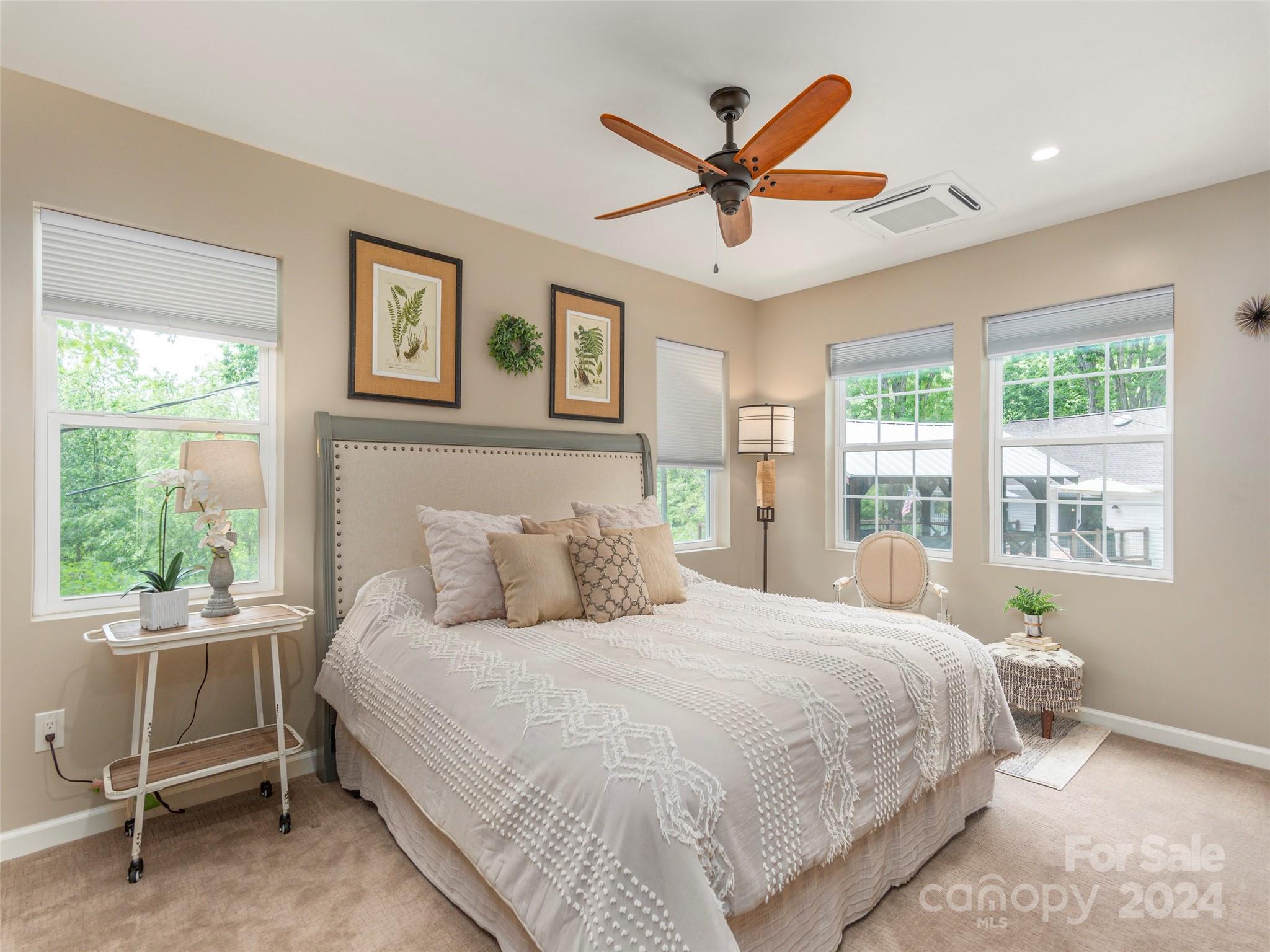 952 Thompson Cove Road Clyde, NC 28721 - Photo 37 of 43 a bedroom with a large bed and a large window