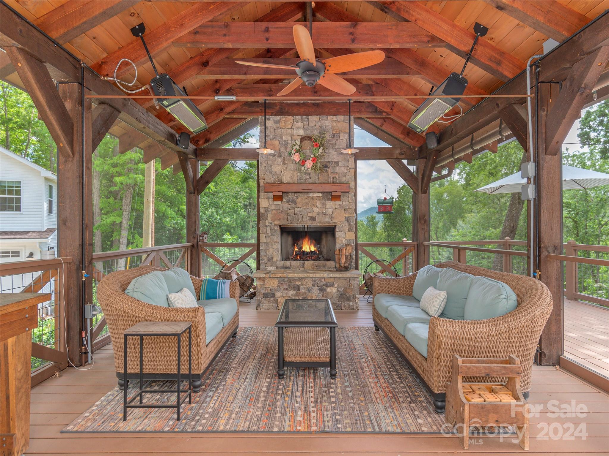 952 Thompson Cove Road Clyde, NC 28721 - Photo 4 of 43 a building outdoor space with patio furniture and potted plants