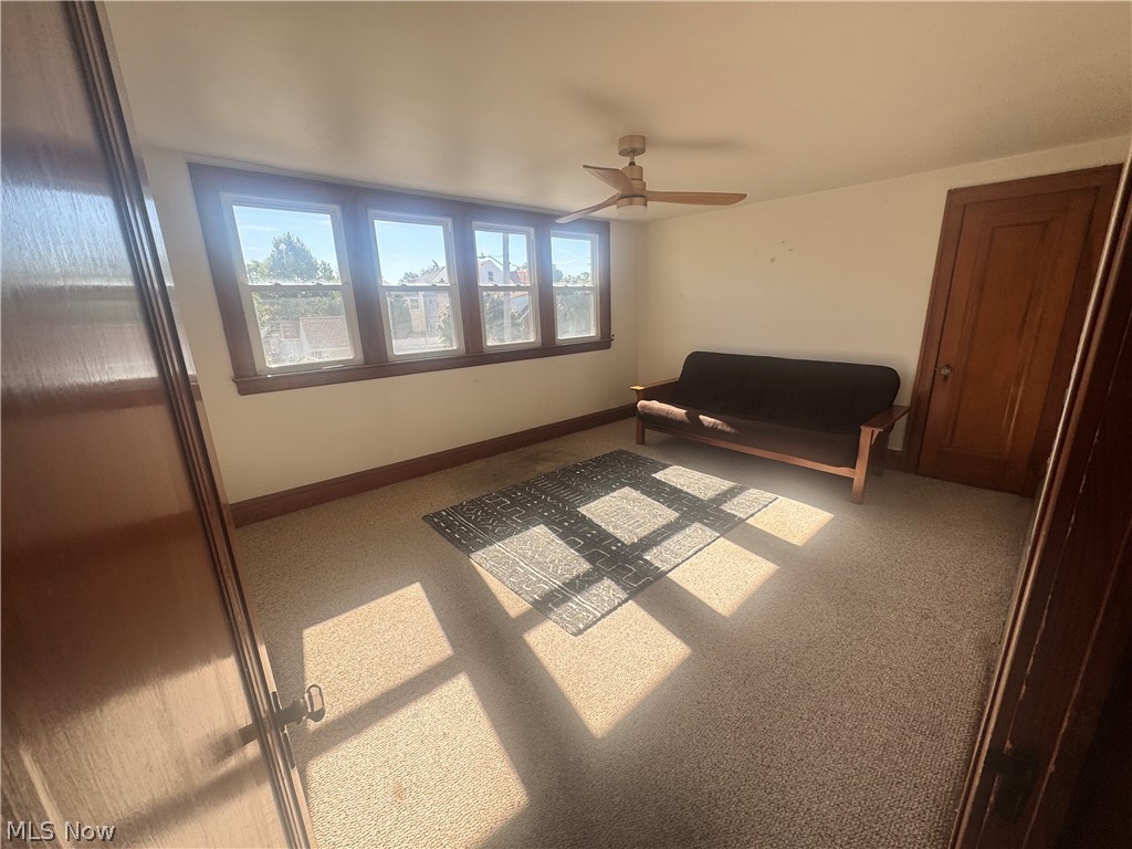 18309 Edgerton Road Cleveland, OH 44119 - Photo 15 of 19 Four-pane window array, ceiling fan, and light-toned wall finishes