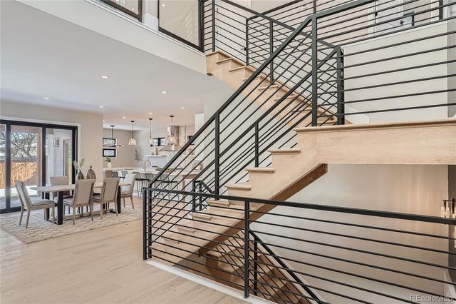 a view of entryway livingroom and hall with wooden floor