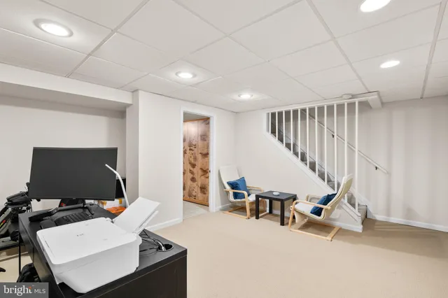 a workspace with furniture and stairs