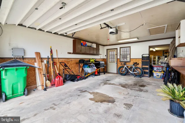 a view of a bike garage with gym equipment