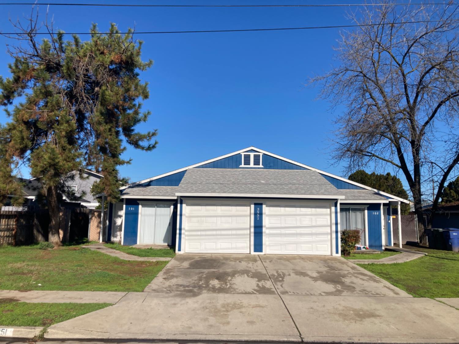 3951 East Dwight Way Fresno, CA 93702 - Photo 1 of 1 a front view of a house with a garden