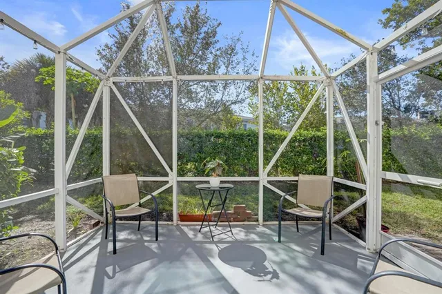 a view of an chairs and table in the balcony