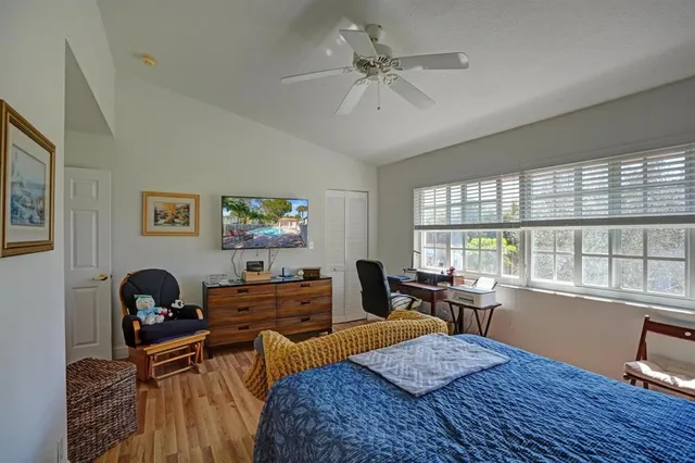 a bedroom with furniture and a window