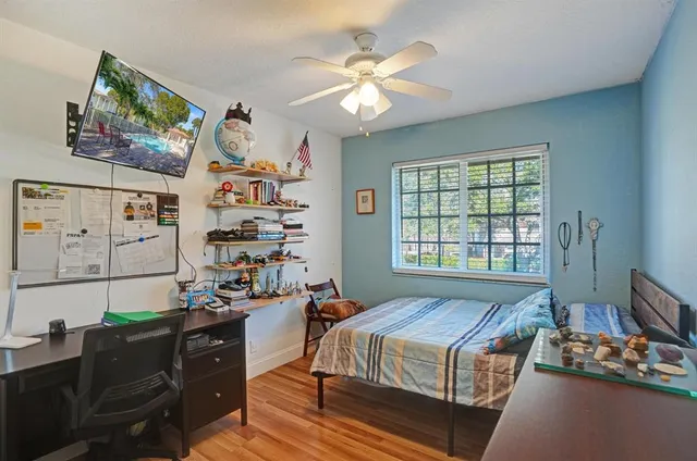 a kitchen with stainless steel appliances kitchen island granite countertop a table and chairs in it