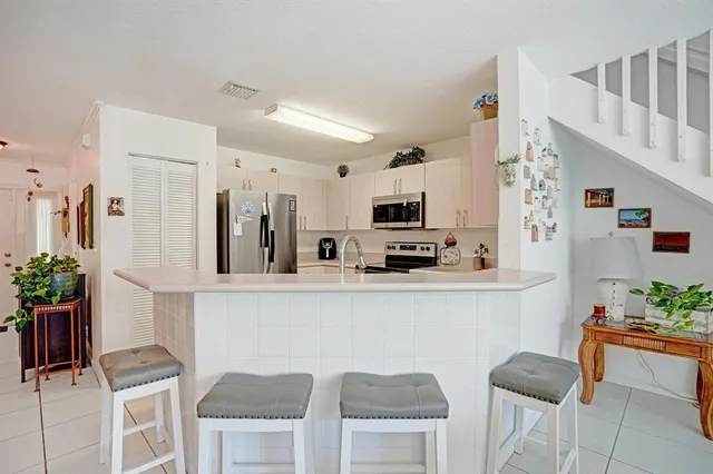 a bathroom with a sink vanity and a mirror
