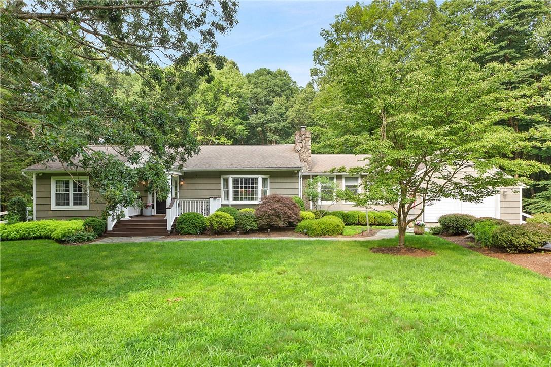 8 Cradle Rock Road East Pound Ridge, NY 10576 - Photo 1 of 1 a view of a house with a yard and sitting area
