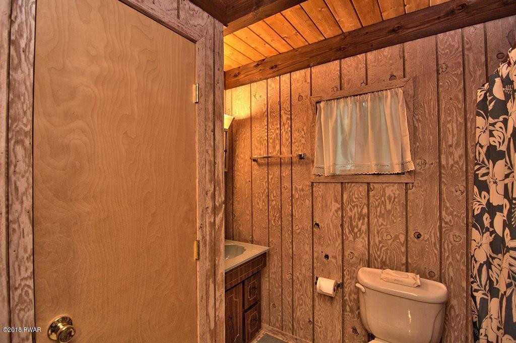 3278 Northgate Road Lake Ariel, PA 18436 - Photo 17 of 40 a bathroom with a toilet a sink and tub