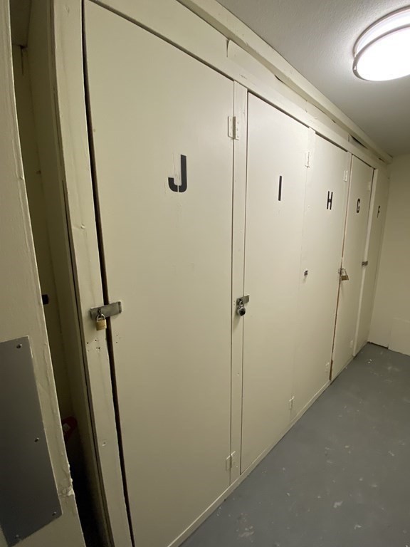 79 Nicholas Road, Unit J Framingham, MA 01701 - Photo 28 of 29 a bathroom with a shower and a sink
