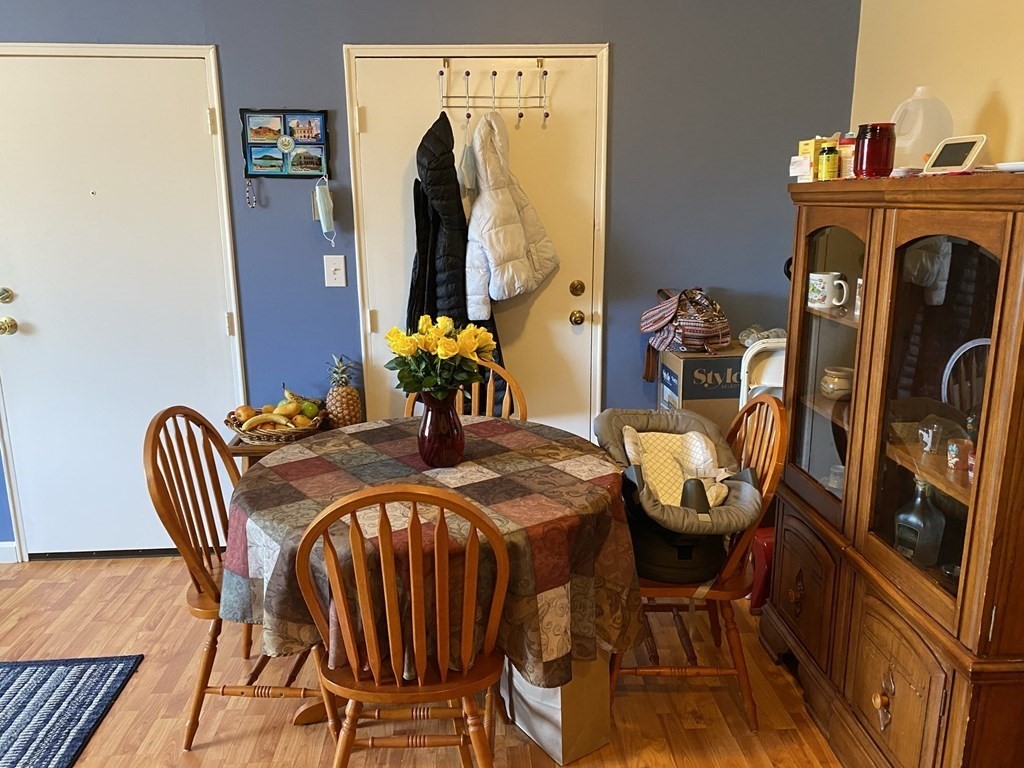 79 Nicholas Road, Unit J Framingham, MA 01701 - Photo 5 of 29 a view of a dining room with furniture and wooden floor