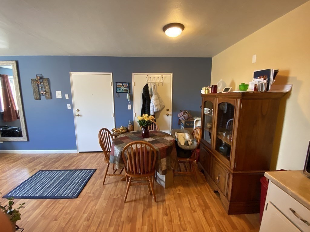 79 Nicholas Road, Unit J Framingham, MA 01701 - Photo 6 of 29 a living room with furniture and wooden floor