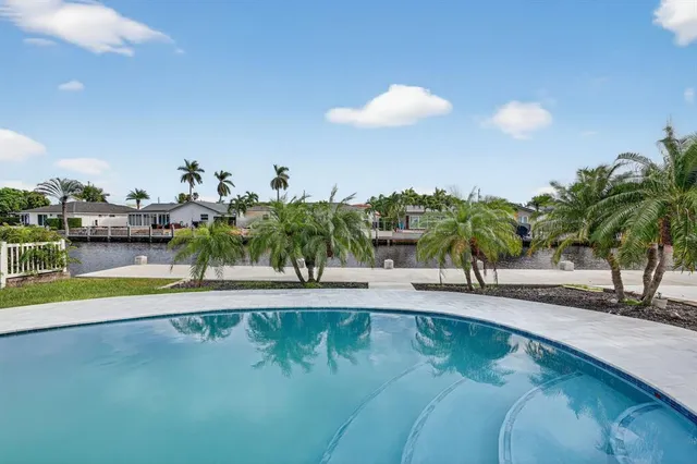 an aerial view of a house with a lake view