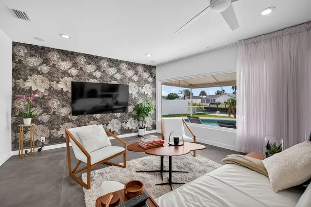 a living room with furniture and a flat screen tv