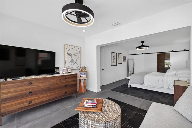 a view of a swimming pool with a table and chairs