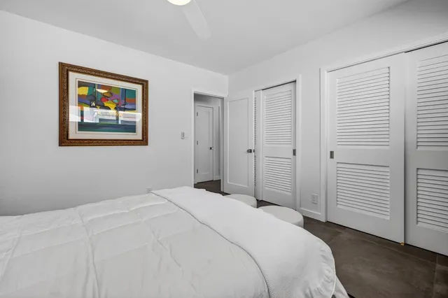 a view of a swimming pool with a table and chairs
