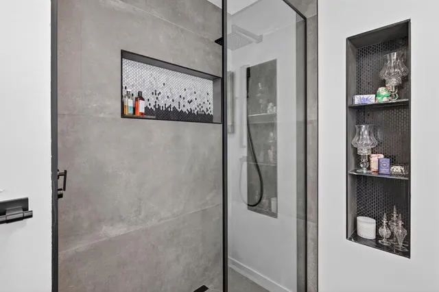 an aerial view of residential houses with outdoor space