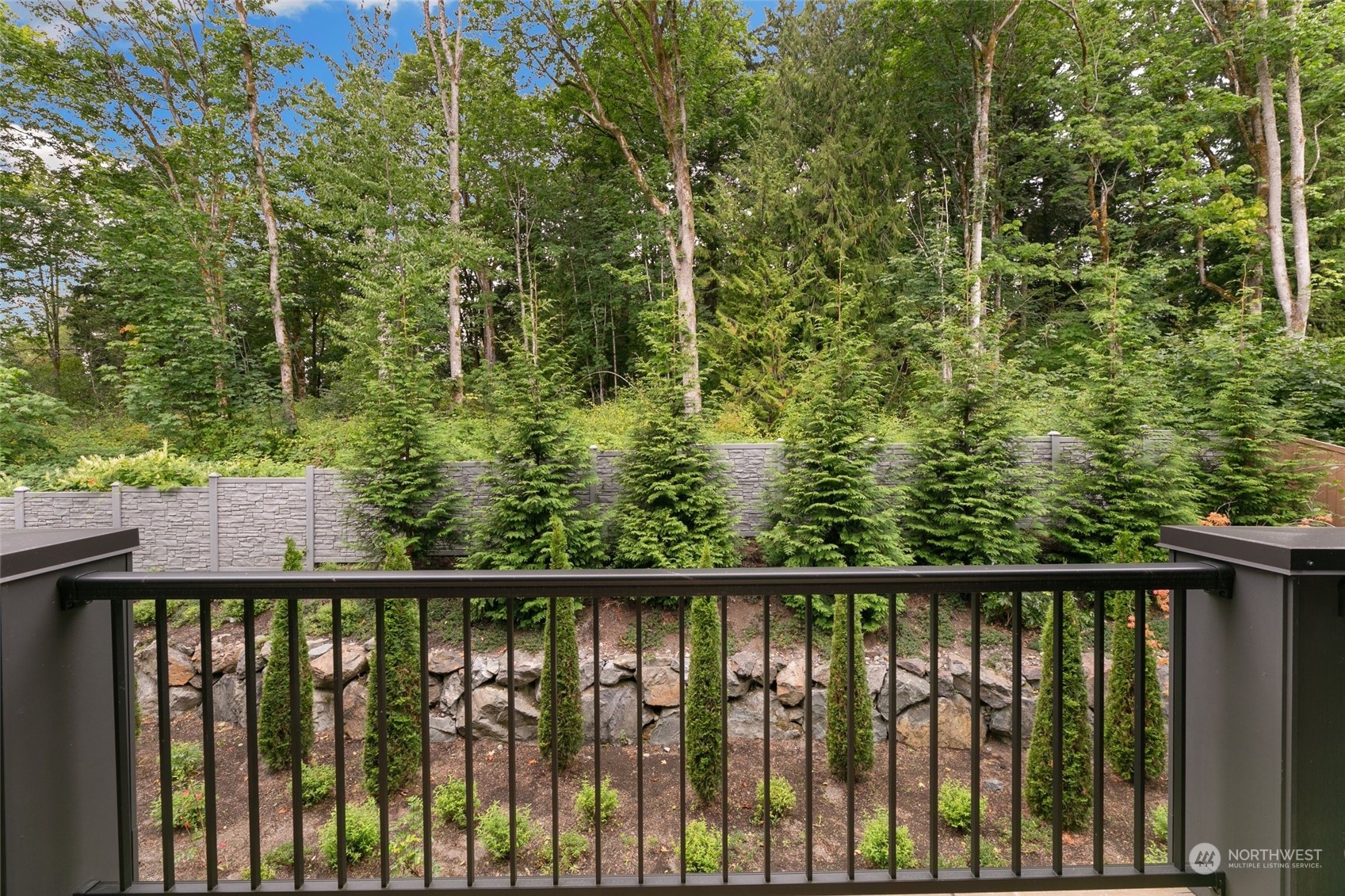 23626 5th Avenue Southeast, Unit C Bothell, WA 98021 - Photo 14 of 39 a view of a wooden fence and trees