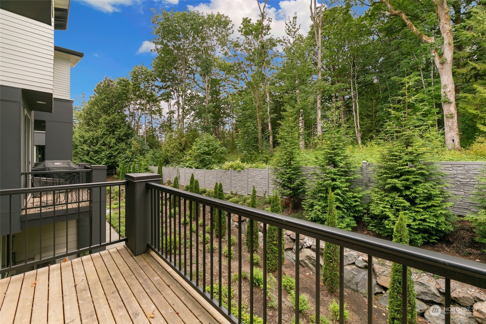 23626 5th Avenue Southeast, Unit C Bothell, WA 98021 - Photo 15 of 39 a balcony with trees in front of it